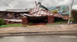 Louisiana resident drives through roads of buildings wrecked by Hurricane Laura