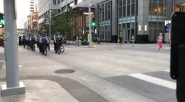 Police on Bikes Patrol Minneapolis Prior to Citywide Curfew Going into Effect