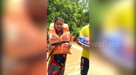 Firefighters rescue woman and her newborn from eastern India flooding
