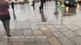 Walking in Paris to Eiffel Tower in the rain