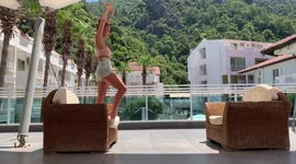 Girl Stretches Legs Next With A Beautiful Scenery At the Back