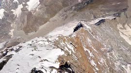 4K drone footage descends the Matterhorn's iconic cliff face at over 100 mph