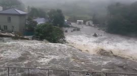 Overflowing river floods roads and homes in Ireland due to heavy rain