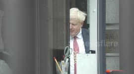 UK PM Boris Johnson avoids Extinction Rebellion protest by using side entrance