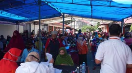 Communities affected by COVID-19 receive social assistance from Indonesian government