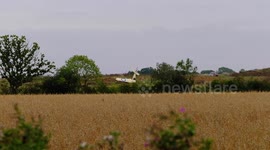 WWI replica British biplane crashes in field in Northamptonshire, UK