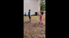 5 year old girl uses bow and Arrow on reluctant brother