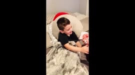 Big brother meets new baby sister