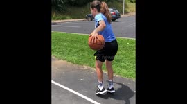 Girl Performs Basketball Trick Shot