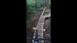 Guy Rides Bike On Skinny Roller Coaster Track