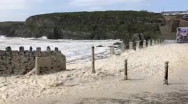 Watch as Storm Ellen brings swirling sea-foam and huge breakers crashing onto the Anglesey shoreline