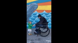 Baby demonstrating her new way of getting on Dads lap