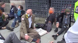 Extinction Rebellion protesters glue themselves outside UK Parliament