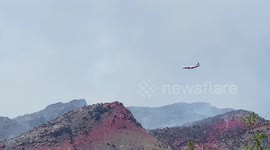 DC10 tanker dropping retardant on the  Bighorn Fire