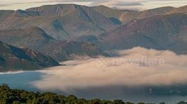 Ethereal time-lapse photography of dancing fog over Ullswater in the Lake District UK