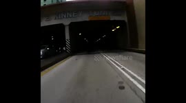 Motorcycle Through Tunnel