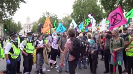 Extinction Rebellion in London makes it rain 'blood money'