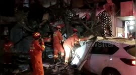 Shop collapses after being crashed into by car, injuring two in China