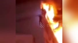 Chinese residents trapped in burning building climb seven storeys down on water pipe to escape