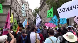 XR protester dances on 'Blood Money' outside 10 Downing Street as Carnival of Corruption hits Whitehall