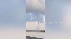 Huge waterspout swirls over sea in northern China