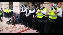 Police and extinction rebellion protesters outside the department for transport building in london