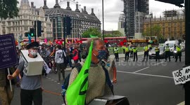 Extinction rebellion train and protestors leave parliament square