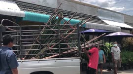 Traders load pickup trucks with stock at Thai market