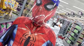 Filipino shopper wears Spiderman costume and face shield amid COVID-19 pandemic