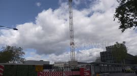 Extinction Rebellion activist scales 150 foot crane in Central London