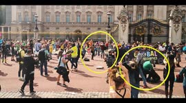 Extinction Rebellion climate activists dance outside Buckingham Palace