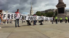 XR protesters hold a free the press sign at Trafalgar Square linked to the blocking of newspaper presses across the country