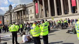 Extinction rebellion protest gather around the national gallery, defying requests to be moved on.
