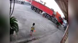 Chinese 6-year-old avoids serious injuries after being run over by truck