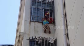 Firefighters save 6-year-old hanging from fourth-floor window in eastern China