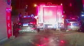 Fire engines force their way through illegally parked cars in China