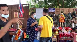 Superstitious locals light fire crackers at Buddhist temple for good luck