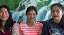 Three Thai people learning English read and discuss the story of Sleeping Beauty.