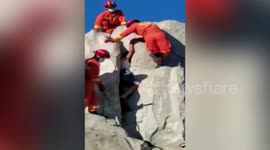 Chinese firefighters free teenaged boy who became trapped in artificial hill