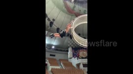 Acrobat from Russia performs tricks on the wheel of death