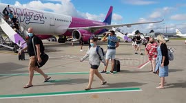 passengers departing flight from Greece at Luton airport