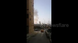 Beirut residents watch as port from August explosion reignites into small fire