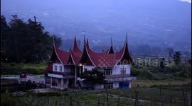 a new building that is the hallmark of Minang Kabau at dusk