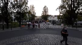 Feminist protesters face policemen during a protest in Nantes, France