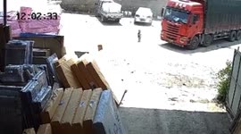Chinese toddler escapes serious injury after being run over by truck