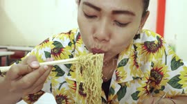 Indonesian Lady Loves and Enjoying Her Chicken Noodle Dinner