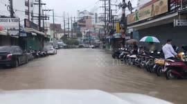 Drivers battle through flooded roads in Phuket, Thailand