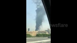 Large plume of smoke billows into the air after fire breaks out at Beirut's port