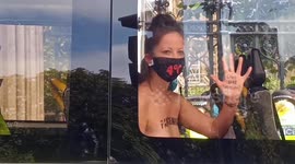 Topless Extinction Rebellion activists hauled away by police after padlocking themselves to gates of UK Parliament