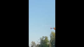Fire plane scooping water from Black Lake